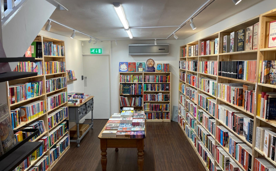 Inside of shop with shelves and book display