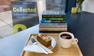 Coffee and cake with a selection of books at Collected
