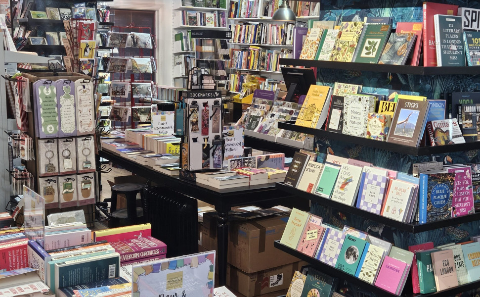 Books on display inside the bookshop - on shelves and tables