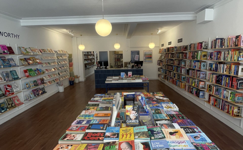 Inside the bookshop with books on display tables and shelves