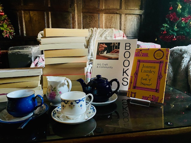 The Book Spa image with coffee and books in panelled room